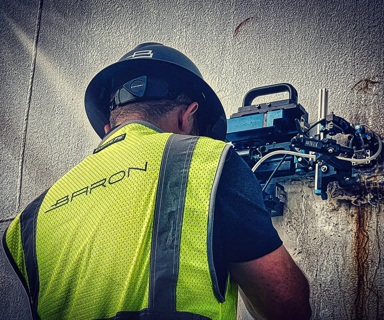Professional ASNT Level II certified NDT technician conducting API 653 compliant above ground storage tank inspection using advanced ultrasonic testing equipment, phased array ultrasonic testing (PAUT), and nondestructive evaluation techniques for industrial petrochemical facility quality assurance and safety compliance