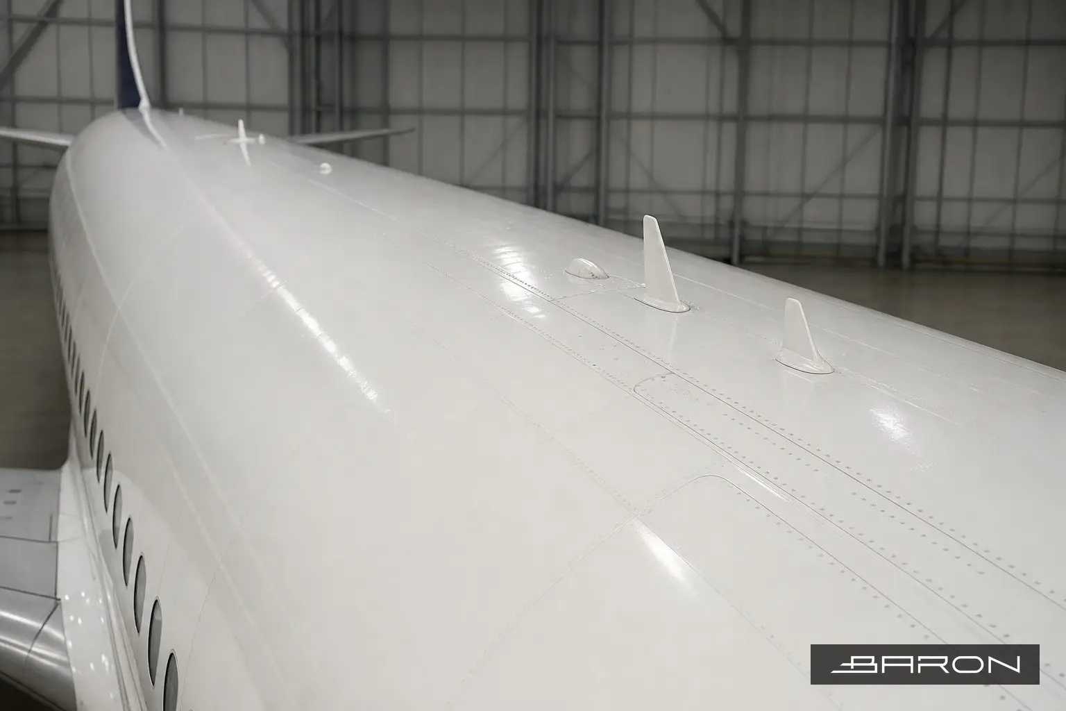 Boeing 737 crown fuselage skin with antenna fairings, inspected by eddy current array for chem-mill step fatigue cracking