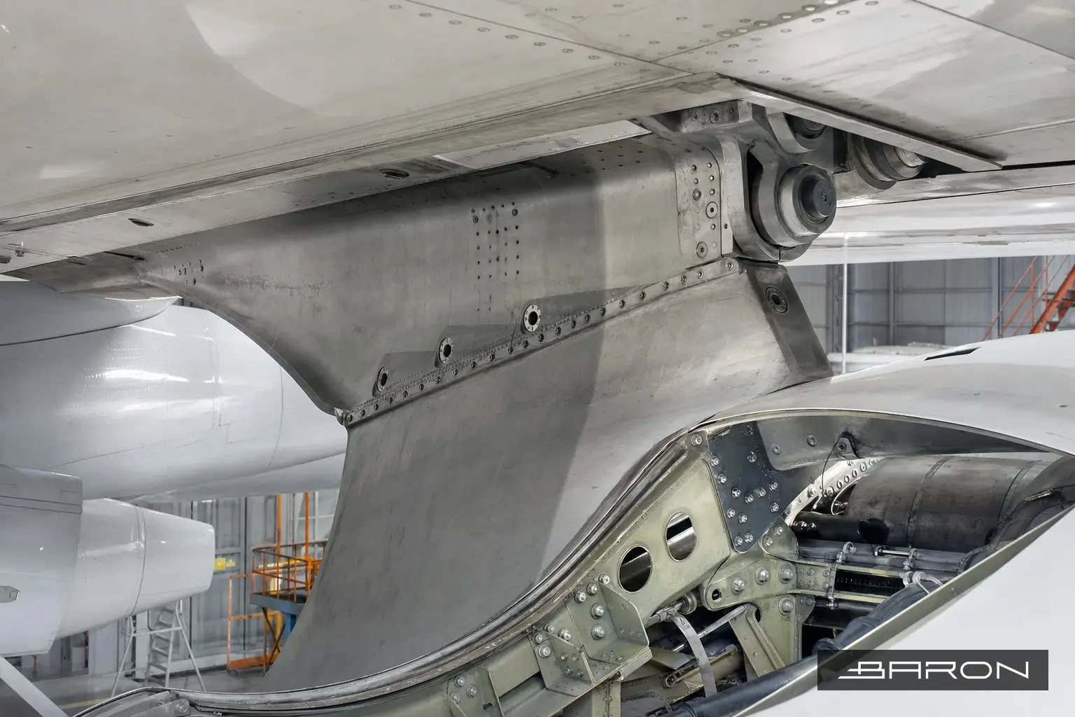 Engine pylon front spar attach fittings on a parked aircraft