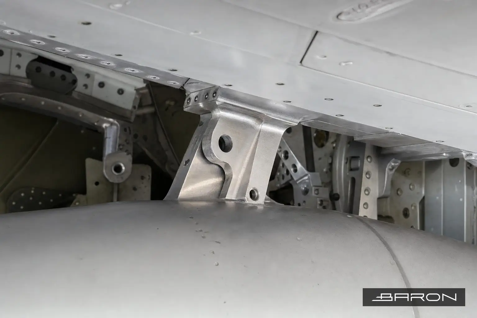 Aircraft engine pylon lower link fittings at the wing rear spar, the area Baron NDT inspects by eddy current