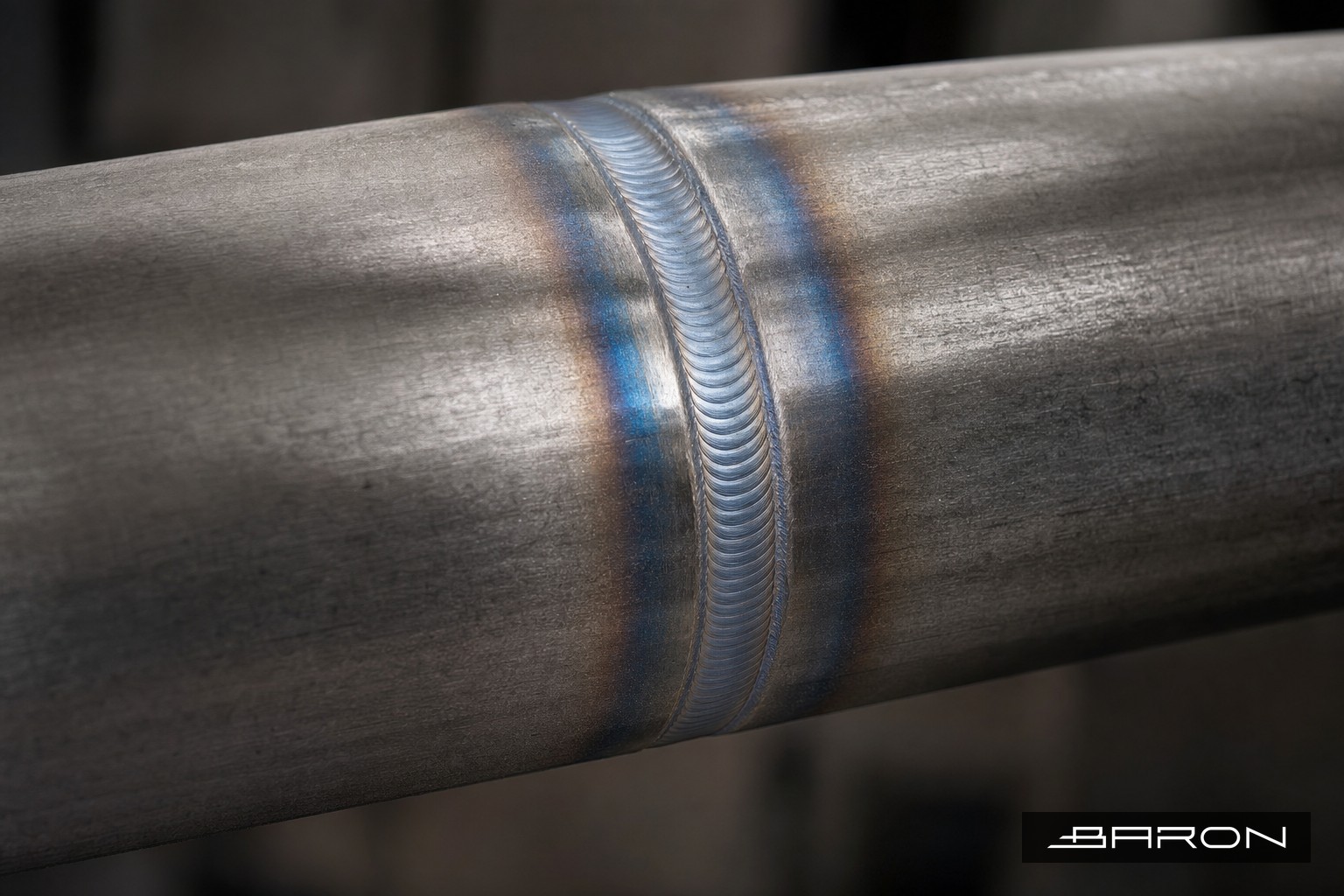 Macro view of a clean carbon steel pipe weld inspected by ultrasonic testing